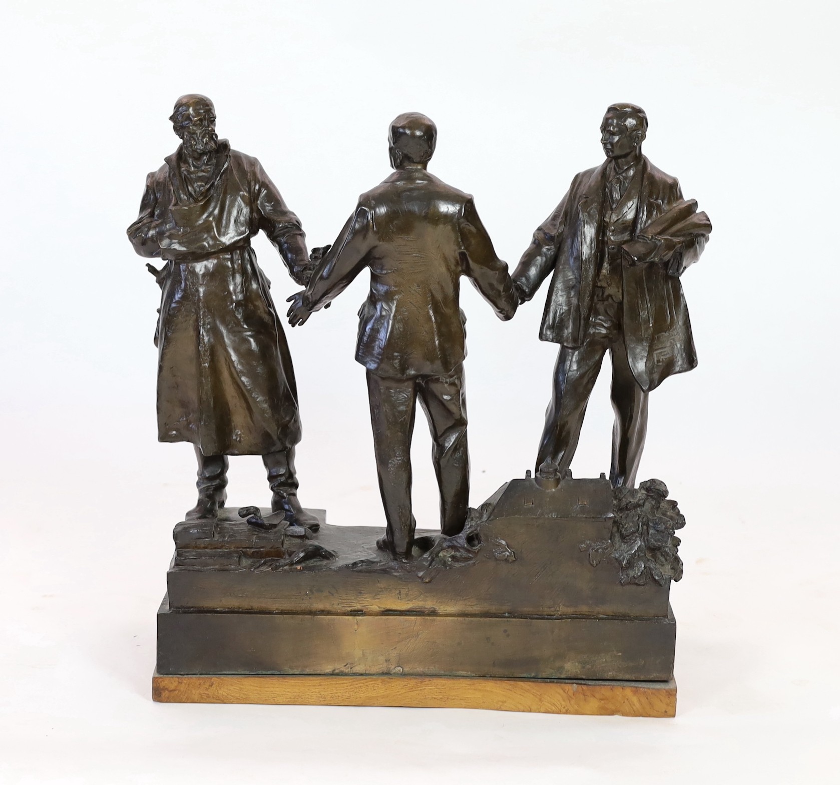 Ladislav Jan Šaloun (Czech, 1870-1946) a large bronze group of a dignitary greeting two men, early 20th century, 72cm high, 64.5cm wide